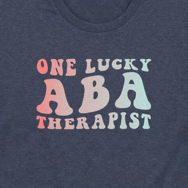 One Lucky ABA Therapist Tee Heather Navy t-shirt, design close-up