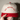 Close-up of the front print on the Red and Natural All Means All embroidered hat