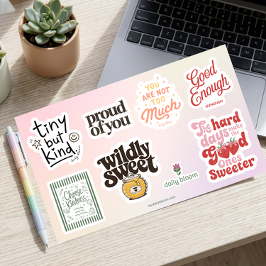 Back to School vinyl sticker sheet on a desk next to a laptop - Daily Bloom