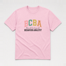 BCBA - Board Certified Behavior Analyst College Style Tee Light Pink t-shirt, front
