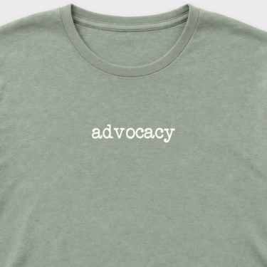 Advocacy Statement Tag-Free Tee Sage t-shirt, design close-up