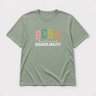 BCBA - Board Certified Behavior Analyst College Style Tee Sage t-shirt, front