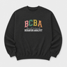 BCBA - Board Certified Behavior Analyst College Style Sweatshirt Black sweatshirt, front