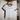 The White and Caviar Don't Apologize for Being You cropped ringer tee on a hanger, front view