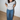 Model wearing the White and Caviar Don't Apologize for Being You cropped ringer tee, front print