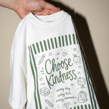 Close-up of the front print on the White Choose Kindness Comfort Colors tee