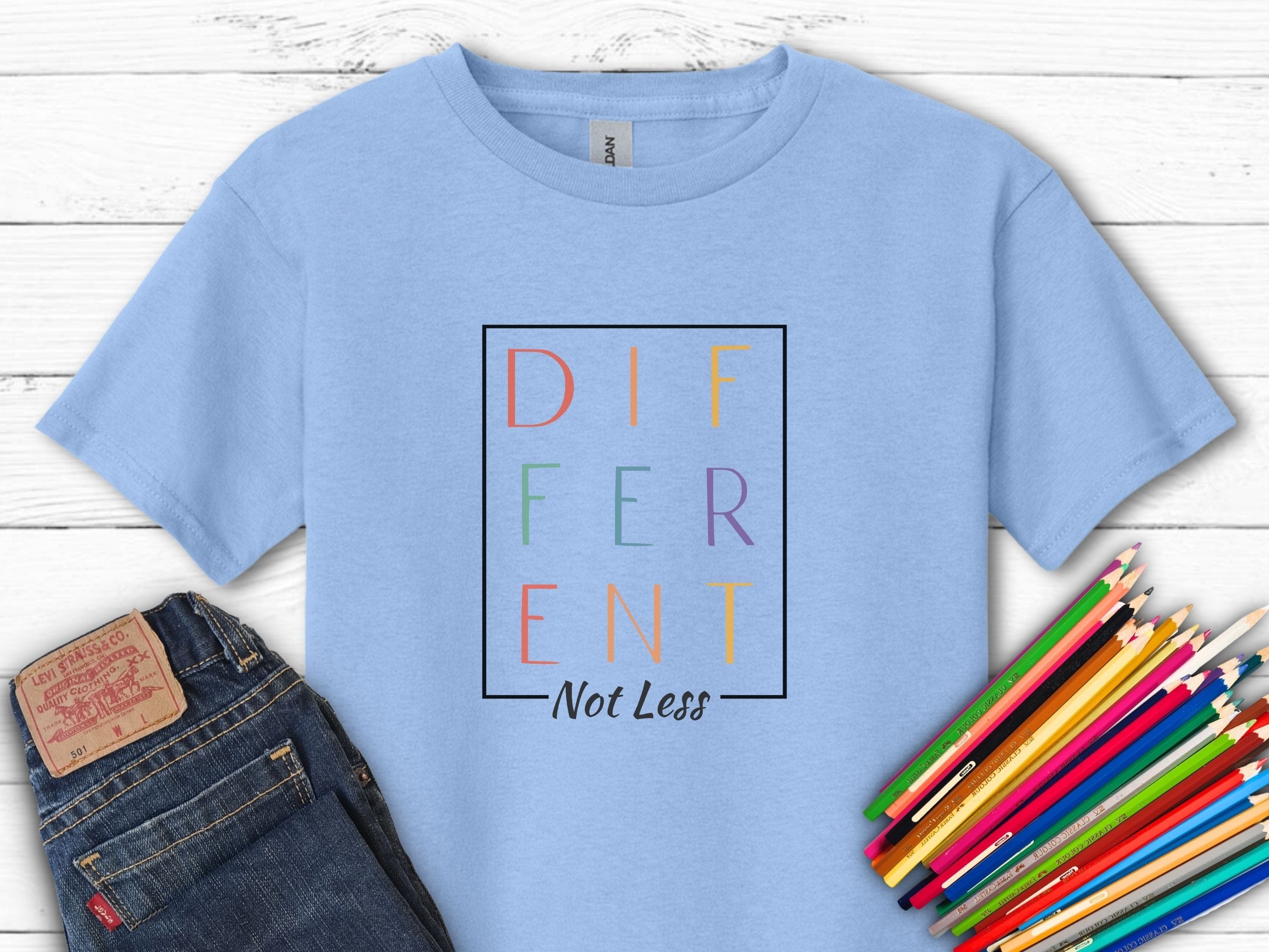 Different Not Less Stacked Letters Kids T-Shirt-Light Blue-Neurodiversity, ADHD & Autism Awareness & Acceptance Kids clothes by Daily Bloom