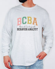 BCBA - Board Certified Behavior Analyst College Style Long Sleeve T-Shirt-Neurodiversity, ADHD & Autism Awareness & Acceptance Long-sleeve by Daily Bloom