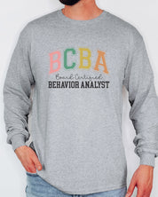 BCBA - Board Certified Behavior Analyst College Style Long Sleeve T-Shirt-Neurodiversity, ADHD & Autism Awareness & Acceptance Long-sleeve by Daily Bloom