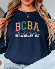 BCBA - Board Certified Behavior Analyst College Style Long Sleeve T-Shirt-Neurodiversity, ADHD & Autism Awareness & Acceptance Long-sleeve by Daily Bloom