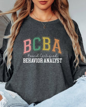 BCBA - Board Certified Behavior Analyst College Style Long Sleeve T-Shirt-Neurodiversity, ADHD & Autism Awareness & Acceptance Long-sleeve by Daily Bloom