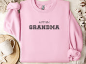 Autism Grandma College Sweatshirt-Light Pink-Neurodiversity, ADHD & Autism Awareness & Acceptance Sweatshirt by Daily Bloom