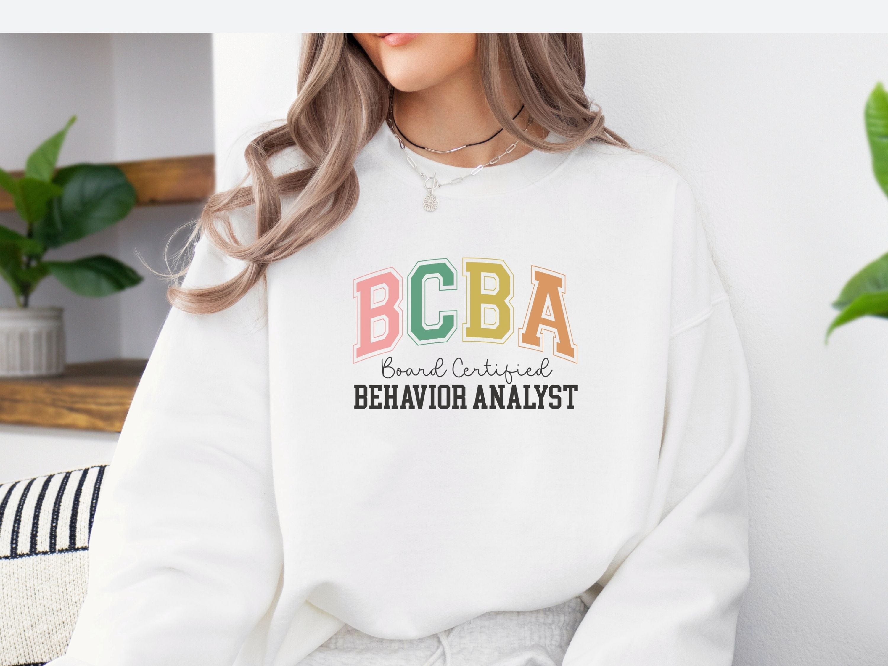 BCBA - Board Certified Behavior Analyst College Style Sweatshirt-Neurodiversity, ADHD & Autism Awareness & Acceptance Sweatshirt by Daily Bloom