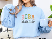 BCBA - Board Certified Behavior Analyst College Style Sweatshirt-Neurodiversity, ADHD & Autism Awareness & Acceptance Sweatshirt by Daily Bloom
