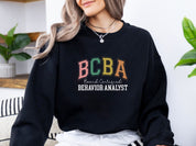 BCBA - Board Certified Behavior Analyst College Style Sweatshirt-Neurodiversity, ADHD & Autism Awareness & Acceptance Sweatshirt by Daily Bloom