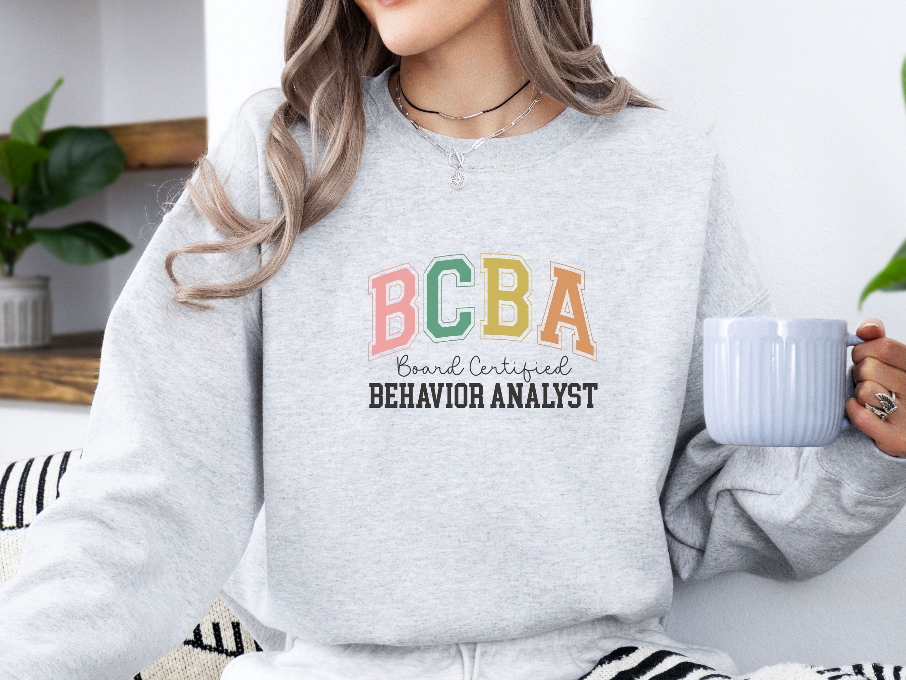 BCBA - Board Certified Behavior Analyst College Style Sweatshirt-Neurodiversity, ADHD & Autism Awareness & Acceptance Sweatshirt by Daily Bloom