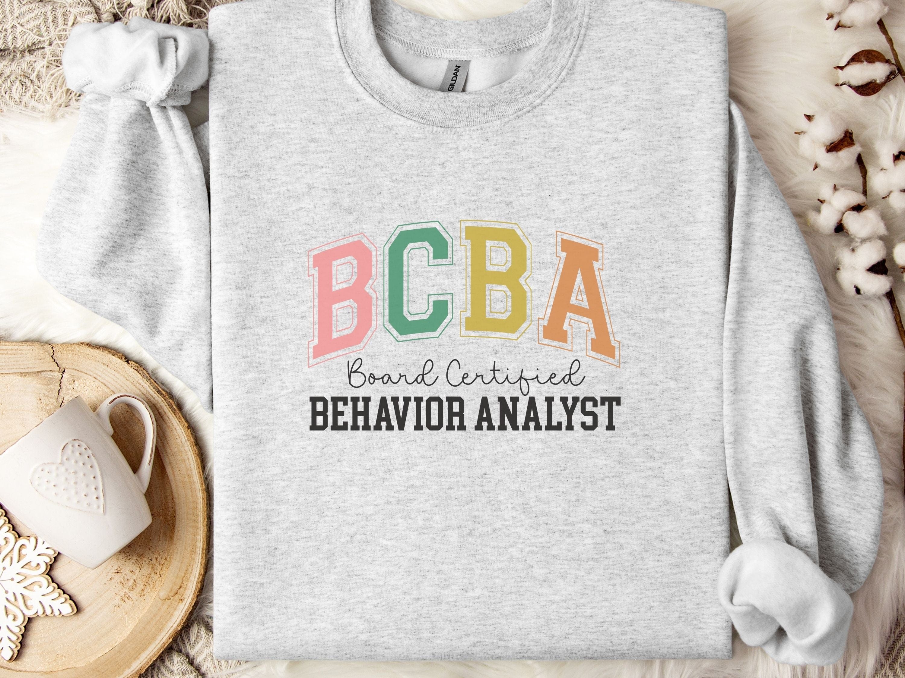 BCBA - Board Certified Behavior Analyst College Style Sweatshirt-Ash-Neurodiversity, ADHD & Autism Awareness & Acceptance Sweatshirt by Daily Bloom