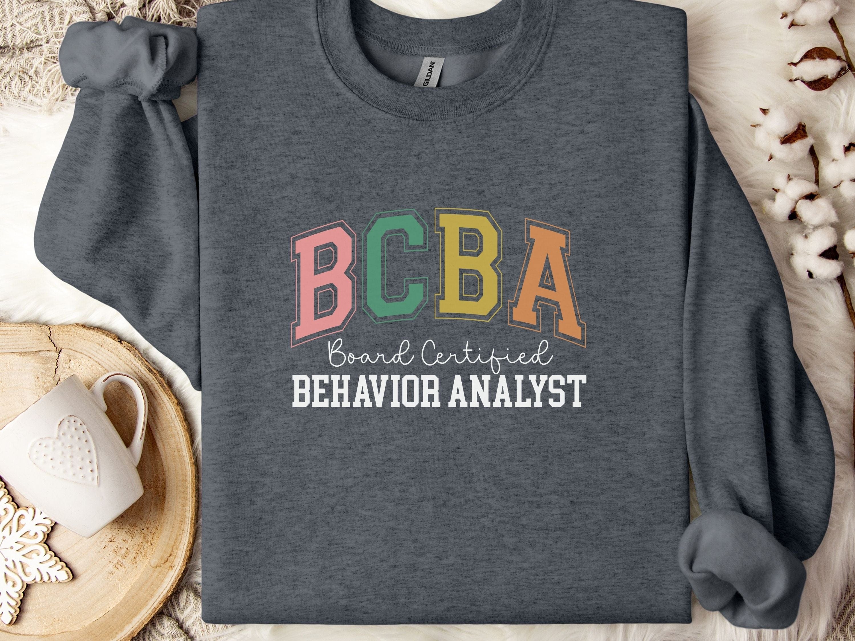 BCBA - Board Certified Behavior Analyst College Style Sweatshirt-Dark Heather-Neurodiversity, ADHD & Autism Awareness & Acceptance Sweatshirt by Daily Bloom