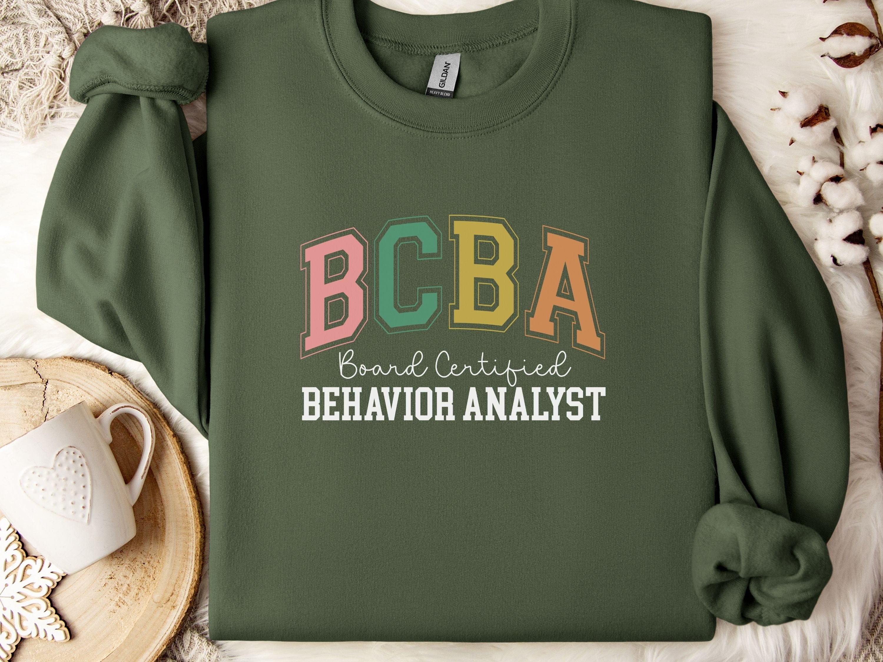 BCBA - Board Certified Behavior Analyst College Style Sweatshirt-Military Green-Neurodiversity, ADHD & Autism Awareness & Acceptance Sweatshirt by Daily Bloom