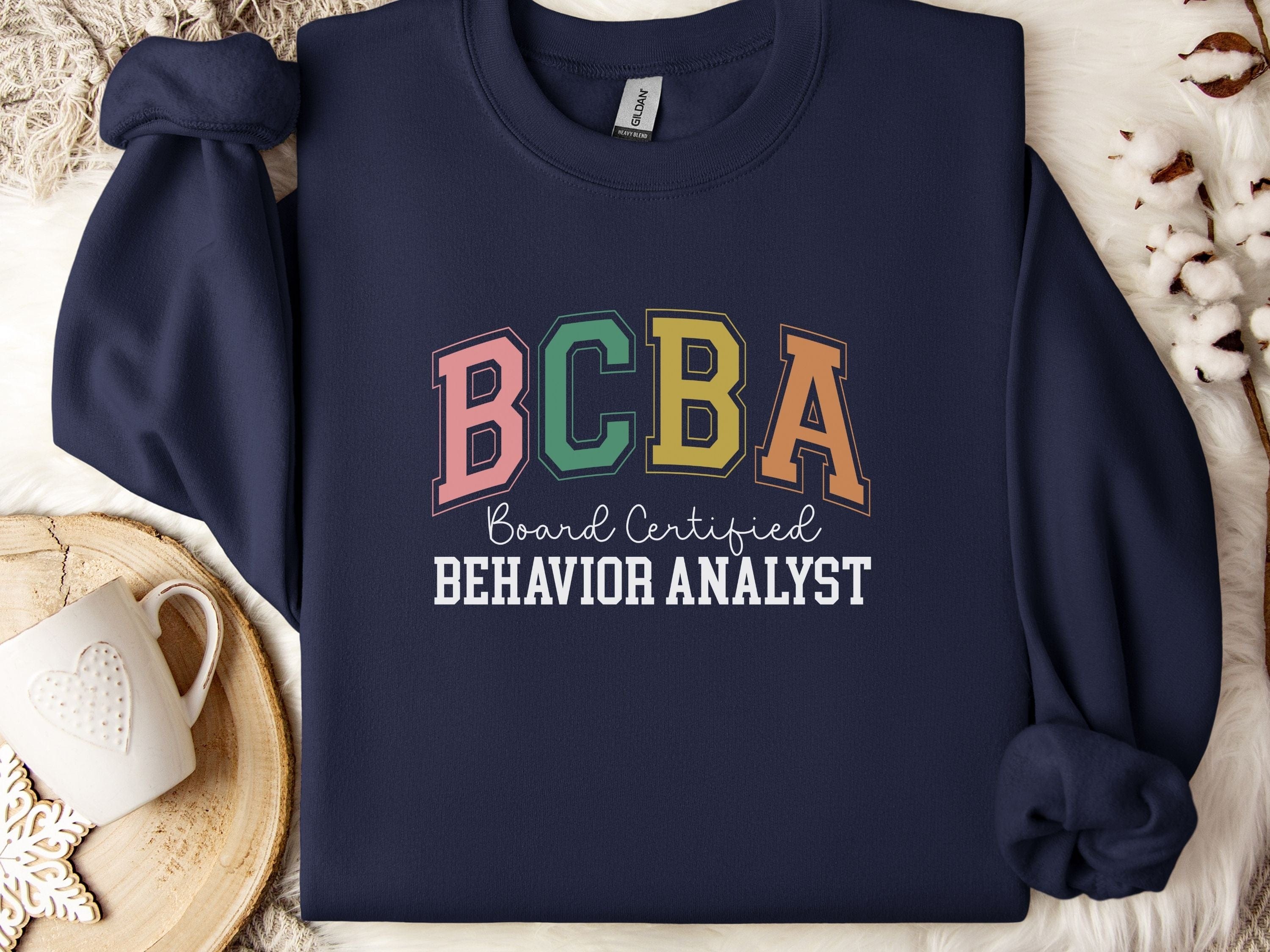 BCBA - Board Certified Behavior Analyst College Style Sweatshirt-Navy-Neurodiversity, ADHD & Autism Awareness & Acceptance Sweatshirt by Daily Bloom