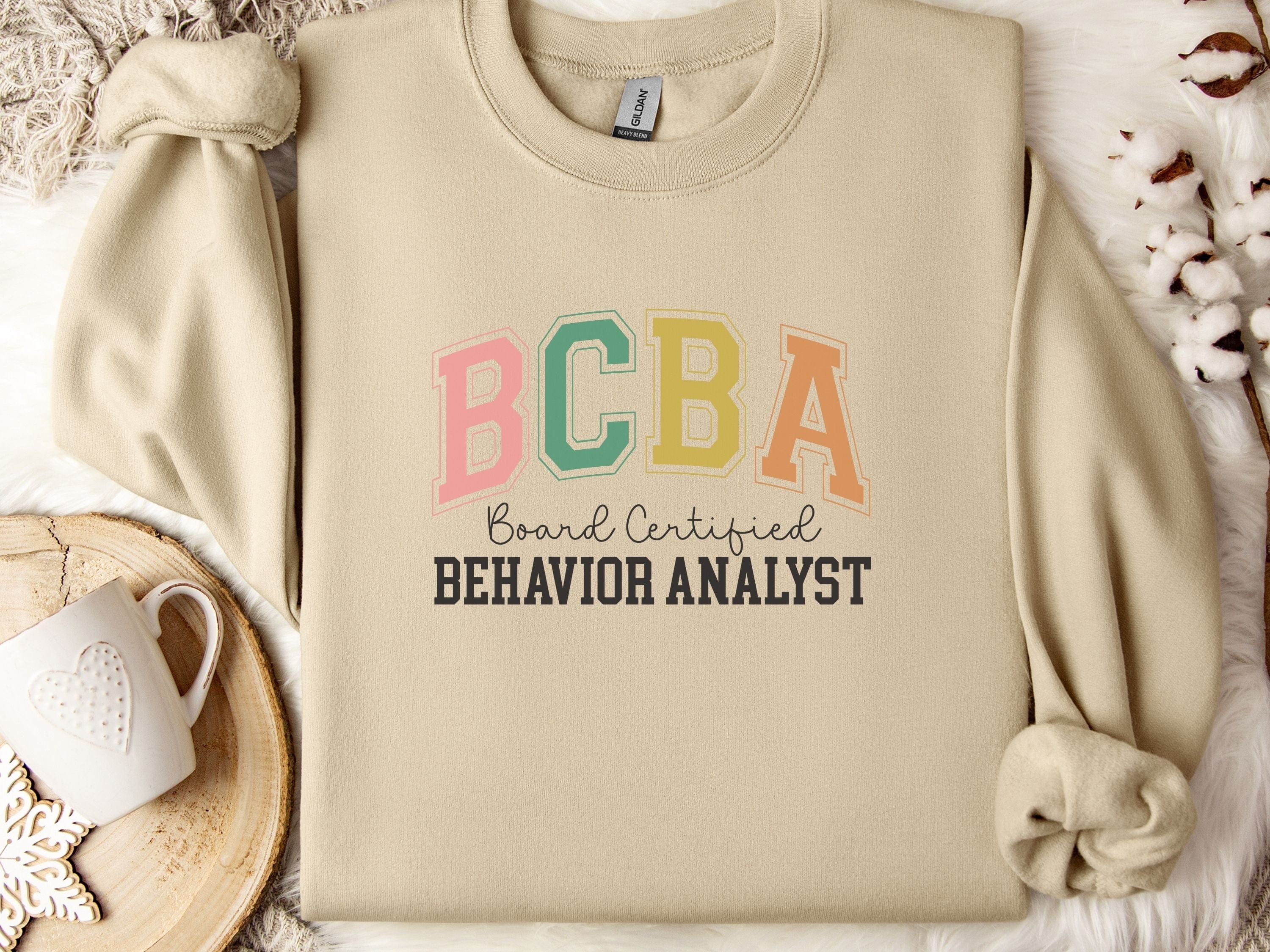 BCBA - Board Certified Behavior Analyst College Style Sweatshirt-Sand-Neurodiversity, ADHD & Autism Awareness & Acceptance Sweatshirt by Daily Bloom