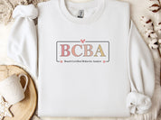 BCBA Outline Sweatshirt-White-Neurodiversity, ADHD & Autism Awareness & Acceptance Sweatshirt by Daily Bloom
