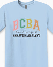 BCBA - Board Certified Behavior Analyst College Style Tee-Neurodiversity, ADHD & Autism Awareness & Acceptance T-Shirt by Daily Bloom