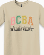 BCBA - Board Certified Behavior Analyst College Style Tee-Neurodiversity, ADHD & Autism Awareness & Acceptance T-Shirt by Daily Bloom