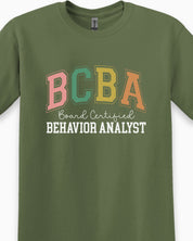 BCBA - Board Certified Behavior Analyst College Style Tee-Neurodiversity, ADHD & Autism Awareness & Acceptance T-Shirt by Daily Bloom