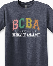 BCBA - Board Certified Behavior Analyst College Style Tee-Neurodiversity, ADHD & Autism Awareness & Acceptance T-Shirt by Daily Bloom