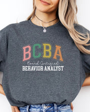 BCBA - Board Certified Behavior Analyst College Style Tee-Neurodiversity, ADHD & Autism Awareness & Acceptance T-Shirt by Daily Bloom