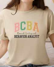 BCBA - Board Certified Behavior Analyst College Style Tee-Neurodiversity, ADHD & Autism Awareness & Acceptance T-Shirt by Daily Bloom