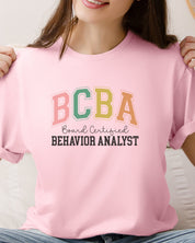 BCBA - Board Certified Behavior Analyst College Style Tee-Neurodiversity, ADHD & Autism Awareness & Acceptance T-Shirt by Daily Bloom