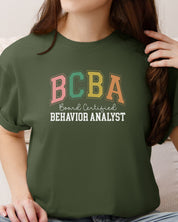 BCBA - Board Certified Behavior Analyst College Style Tee-Neurodiversity, ADHD & Autism Awareness & Acceptance T-Shirt by Daily Bloom