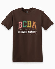 BCBA - Board Certified Behavior Analyst College Style Tee-Dark Chocolate-Neurodiversity, ADHD & Autism Awareness & Acceptance T-Shirt by Daily Bloom
