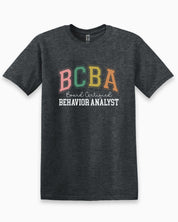 BCBA - Board Certified Behavior Analyst College Style Tee-Dark Heather Grey-Neurodiversity, ADHD & Autism Awareness & Acceptance T-Shirt by Daily Bloom