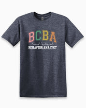 BCBA - Board Certified Behavior Analyst College Style Tee-Heather Navy-Neurodiversity, ADHD & Autism Awareness & Acceptance T-Shirt by Daily Bloom
