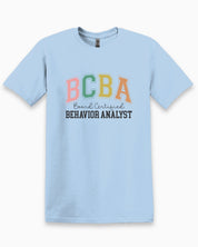 BCBA - Board Certified Behavior Analyst College Style Tee-Light Blue-Neurodiversity, ADHD & Autism Awareness & Acceptance T-Shirt by Daily Bloom
