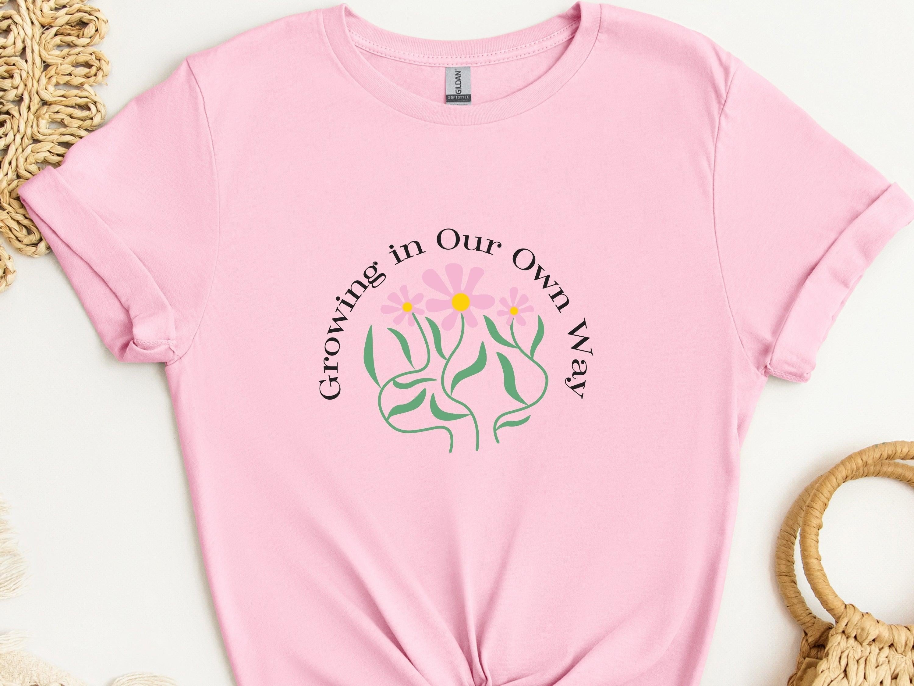 Growing In Our Own Way Tee-Light Pink-Neurodiversity, ADHD & Autism Awareness & Acceptance T-Shirt by Daily Bloom