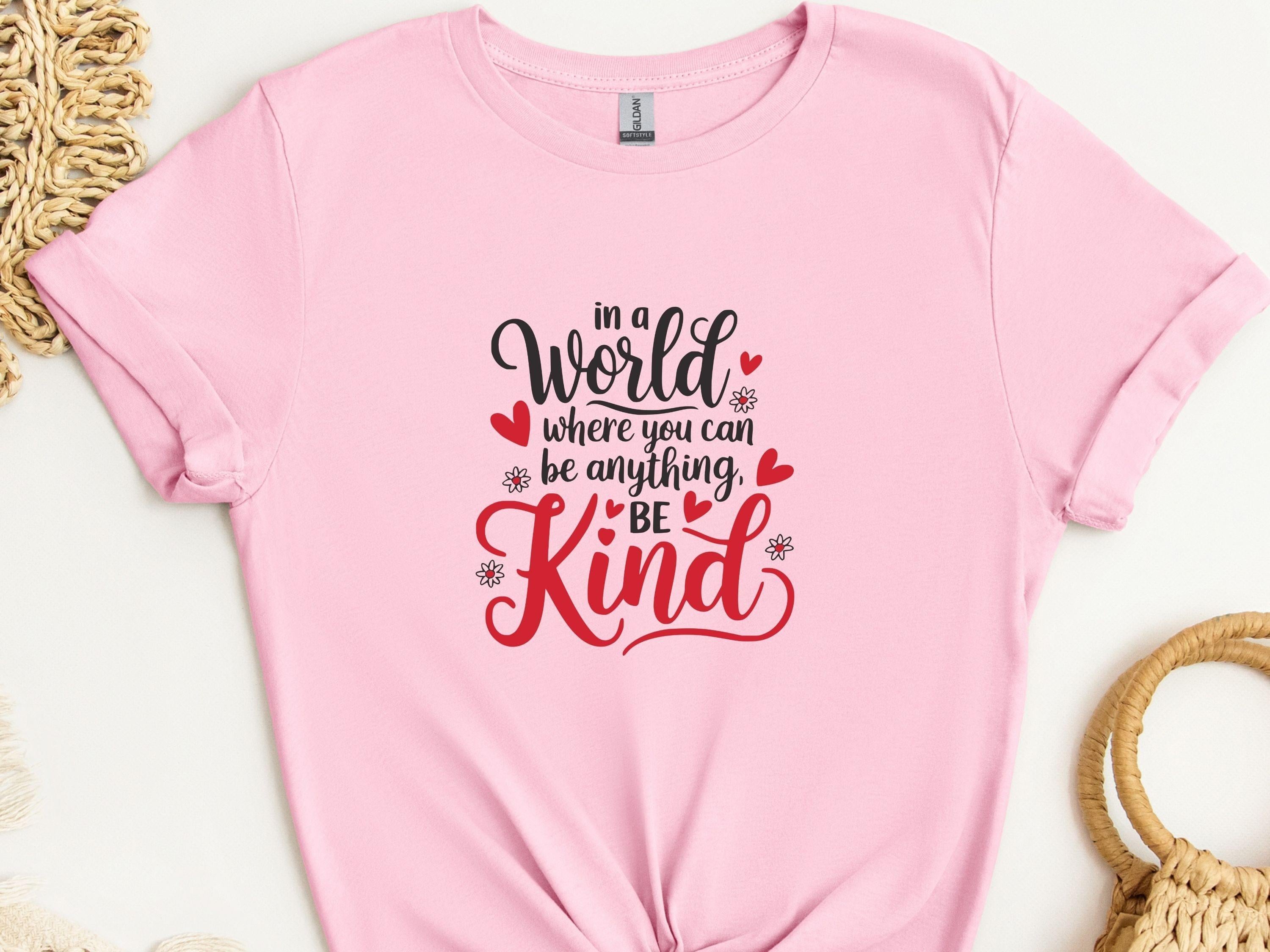 In A World Where You Can Be Anything Be Kind Tee-Light Pink-Neurodiversity, ADHD & Autism Awareness & Acceptance T-Shirt by Daily Bloom