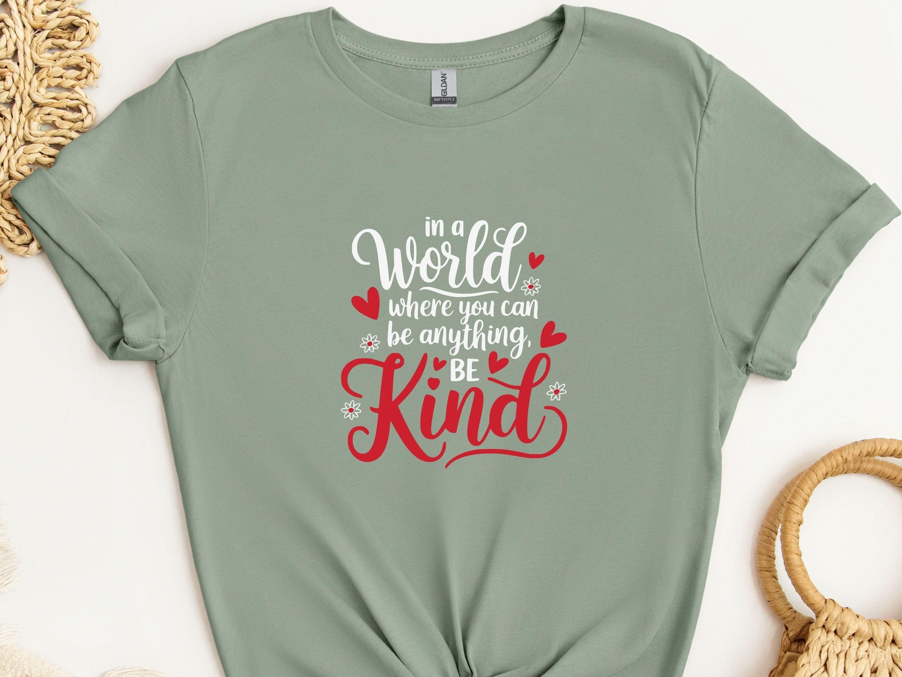 In A World Where You Can Be Anything Be Kind Tee-Sage-Neurodiversity, ADHD & Autism Awareness & Acceptance T-Shirt by Daily Bloom