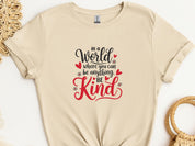 In A World Where You Can Be Anything Be Kind Tee-Sand-Neurodiversity, ADHD & Autism Awareness & Acceptance T-Shirt by Daily Bloom