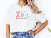 One Lucky ABA Therapist Tee-Neurodiversity, ADHD & Autism Awareness & Acceptance T-Shirt by Daily Bloom