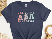 One Lucky ABA Therapist Tee-Heather Navy-Neurodiversity, ADHD & Autism Awareness & Acceptance T-Shirt by Daily Bloom