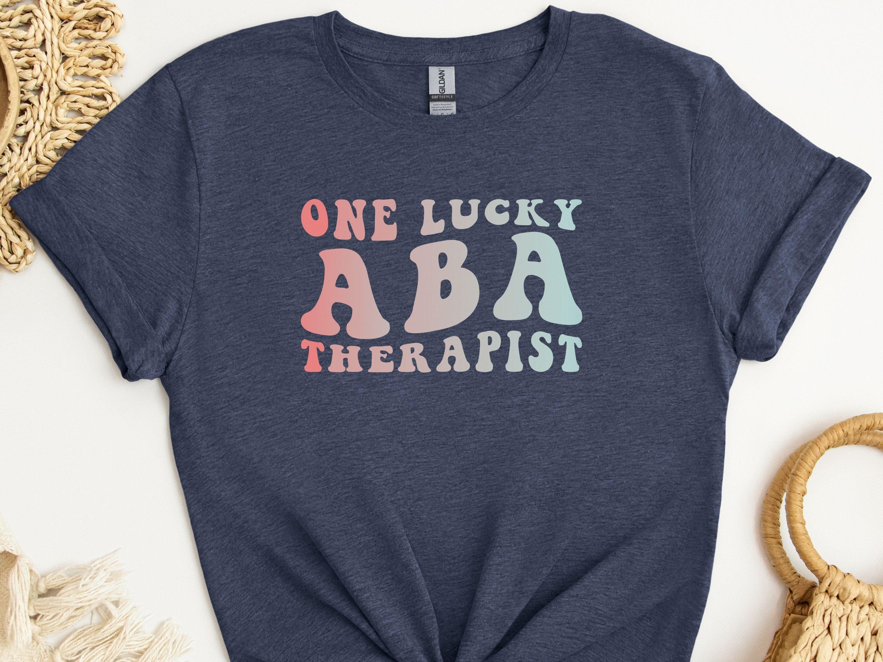 One Lucky ABA Therapist Tee-Heather Navy-Neurodiversity, ADHD & Autism Awareness & Acceptance T-Shirt by Daily Bloom