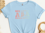 One Lucky ABA Therapist Tee-Light Blue-Neurodiversity, ADHD & Autism Awareness & Acceptance T-Shirt by Daily Bloom