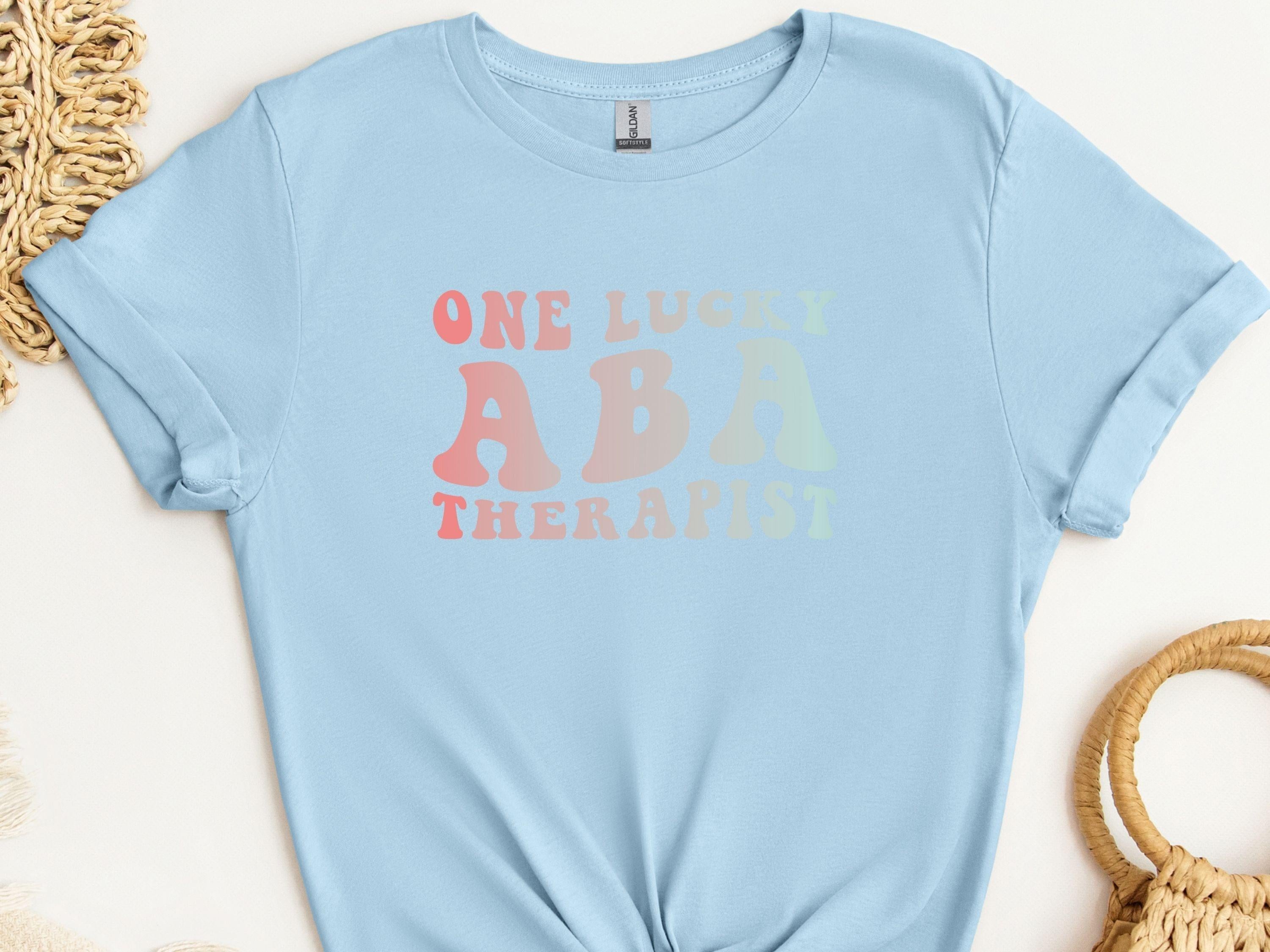 One Lucky ABA Therapist Tee-Light Blue-Neurodiversity, ADHD & Autism Awareness & Acceptance T-Shirt by Daily Bloom