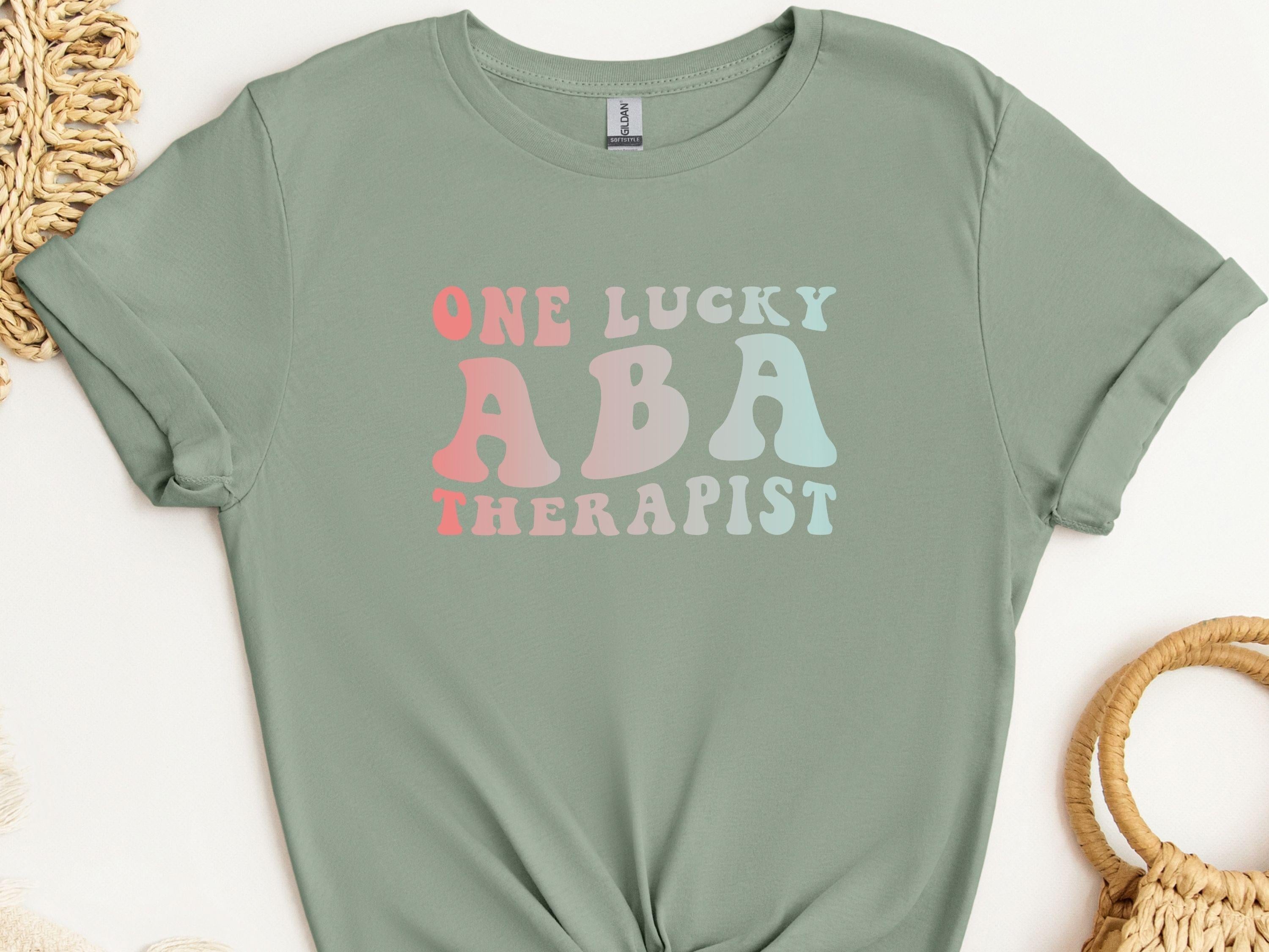 One Lucky ABA Therapist Tee-Sage-Neurodiversity, ADHD & Autism Awareness & Acceptance T-Shirt by Daily Bloom