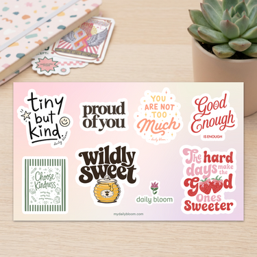 Back to School sticker sheet with notebook and individual Daily Bloom stickers on a desk